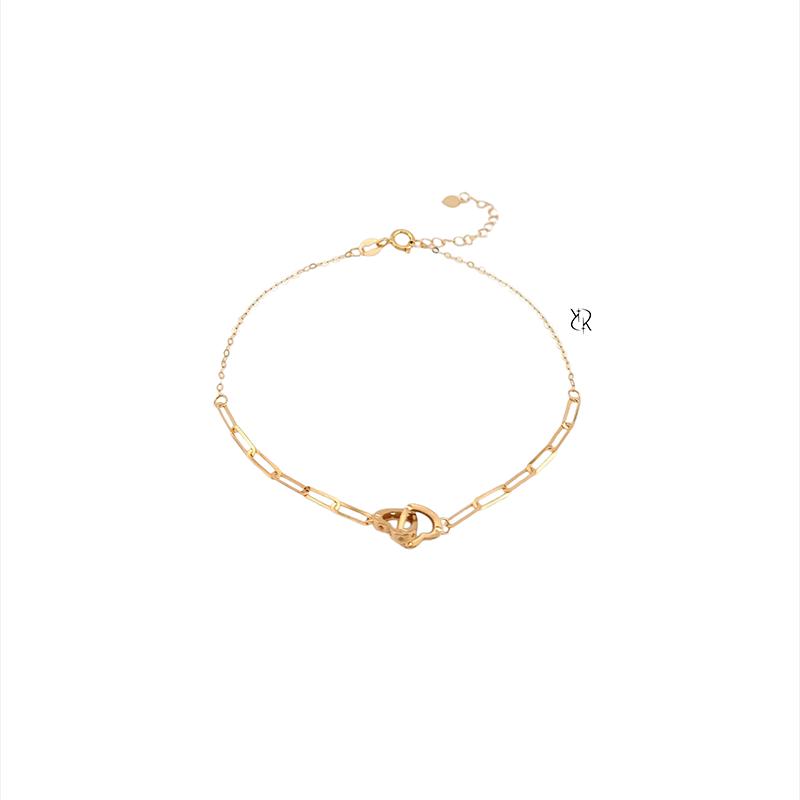 دستبند زنانه طلا ۱۸ عیار دستبند طلا طرح هرمس و دوقلب درهم گالــری طلا رابــونـل