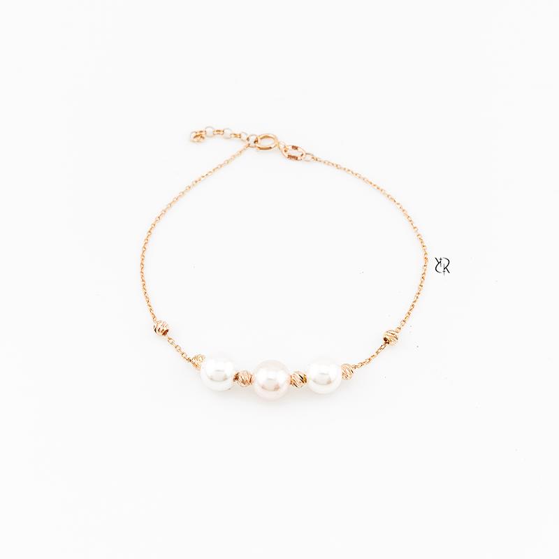 دستبند زنانه طلا ۱۸ عیار دستبند طلا طرح 3 مروارید و گوی البرنادو گالــری طلا رابــونـل