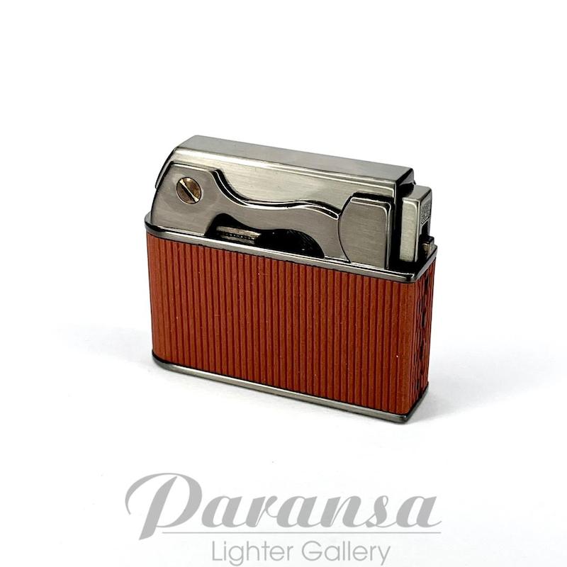 تصویر فندک جوبون اتومات در پران — فندک بنزینی با در اتومات و چخماق قفل‌شونده همراه سنگ و فیتیله یدکی