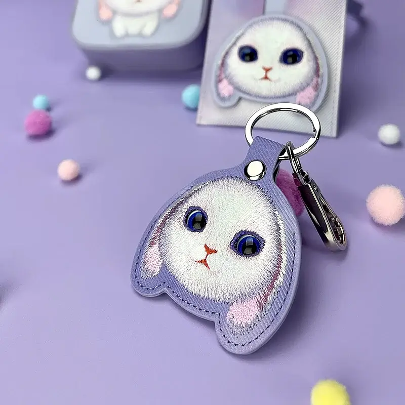 جاکیلیدی Nimmy/جاسوییچی Friends Big Eyes Cute Pets Embroidery Apple AirTag Case Holder Keychain Locator خرگوش بنفش