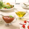 ست دو عددی سس خوری شیشه ای دسته دار لیمون روی میز ناهارخوری شیک