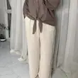 شلوار زنانه کشی پارچه‌ای رنگ شیری | راحتی و خنک | کانگومام