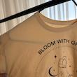 تیشرت زنانه آستین کوتاه نسکافه‌ای طرح Bloom With Grace | پارچه نخی | کانگومام