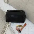 کیف آرایش چرم طرح دار