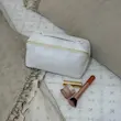 کیف آرایش چرم طرح دار