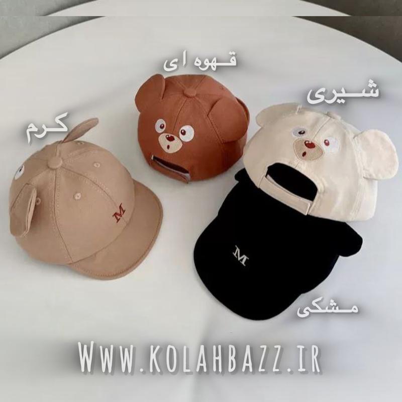 کلاه نوزادی طرح گوشدار m پشت کلاه گلدوزی داره،نقاب منعطف