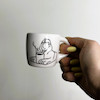 Abolhoul drinks coffee