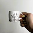 Abolhoul drinks coffee