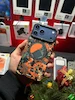 قاب یانگ کیت مدل Pixel Camouflage 2.0 نارنجی برای آیفون 17 پرومکس – طراحی سایبری ارتشی با مگسیف