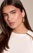 گوشواره حلقه‌ای طلایی با طراحی اورلپ و فرم مدرن PrettyLittleThing از انگلیس