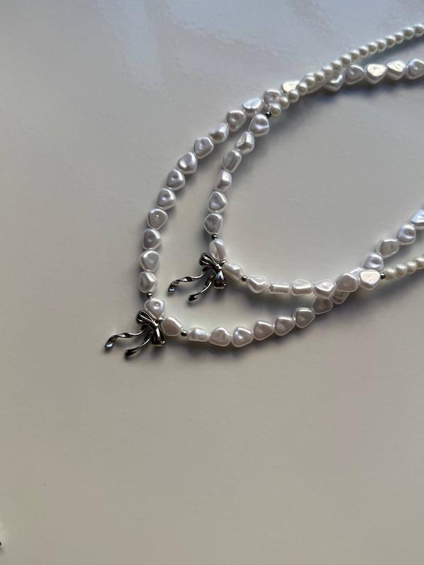 مروارید دفرمه و پاپیون پیچی