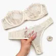 ست شورت و سوتین تورگاز دکلته کرم طرح برگ