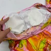 مایو زنانه کاپ‌دار دامنی صورتی طرح‌دار با کلاه