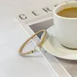 دستبند چرم و طلا زنانه طرح امگا کد MT2270