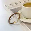 دستبند چرم و طلا زنانه طرح امگا کد MT2269