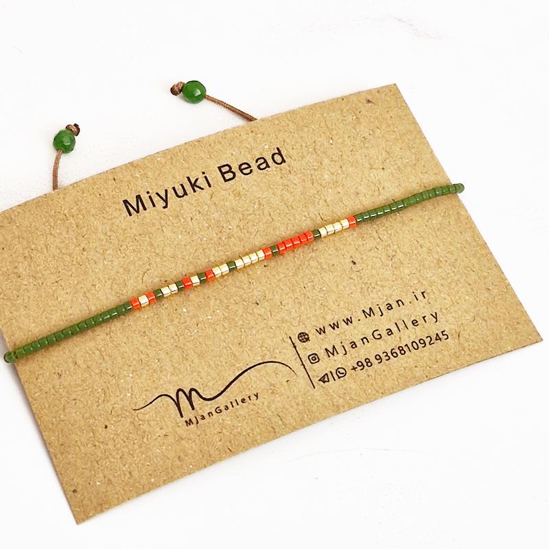 M0324 _ دستبند مورس سبز، نارنجی و طلایی 1 رج ( منجوق میوکی )