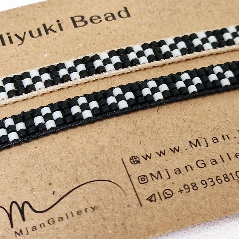 M0370 _ دستبند باریک سفید مشکی مات نخ کرم یا مشکی ( منجوق میوکی )3 رج 