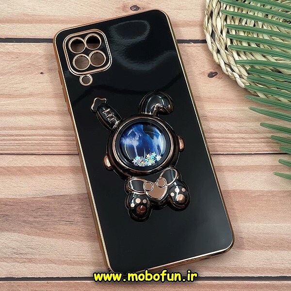 قاب گوشی Galaxy A12 - Galaxy M12 سامسونگ طرح ژله ای فضانورد آکواریومی مای کیس گلد لاین دور طلایی استندشو محافظ لنز دار مشکی کد 1448
