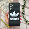قاب گوشی Galaxy A34 سامسونگ سیلیکون ژله ای طرح آدیداس adidas پافر PC زیر بسته محافظ لنز دار مشکی کد 738