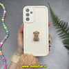 قاب گوشی Galaxy A15 سامسونگ طرح سیلیکونی Solid عروسکی خرسی جیر نگین دار بند دار پام پام محافظ لنزدار کرم کد 10046