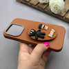قاب گوشی iPhone 16 Pro آیفون لدر دیزاین SOFT Lether Design سیلیکونی پاپ سوکت دار عروسکی طرح چرم عسلی کد 83382