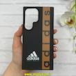 قاب گوشی Galaxy S24 Ultra سامسونگ Silicon Case سیلیکونی ژله ای لنز برجسته فانتزی طرح adidas کد 1-15-101095