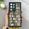 قاب گوشی Galaxy S24 Ultra سامسونگ سیلیکونی Solid فانتزی چاپی محافظ لنزدار درجه یک طرح کتابخانه مشکی کد 103656