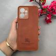 قاب گوشی Redmi Note 12 4G شیائومی اورجینال برند BURBERRY 2026 طرح دوخت HARD چرمی محافظ لنزدار قهوه ای کد 96450