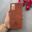 قاب گوشی Redmi Note 12S شیائومی اورجینال برند BURBERRY 2026 طرح دوخت HARD چرمی محافظ لنزدار قهوه ای کد 96453