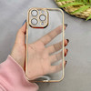 قاب گوشی iPhone 14 Pro Max آیفون طرح الکتروپلیتینگ ژله ای شفاف محافظ لنز دار طلایی کد 97478
