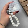کاور AirPods 4 ایرپاد اپل لاکچری دونات برجسته شفاف بندآویز مرواریدی کد 98216