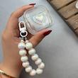 کاور AirPods 4 ایرپاد اپل لاکچری قلب هولوگرامی برجسته شفاف بندآویز مرواریدی کد 98219