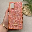 قاب گوشی Galaxy A06 سامسونگ نگین دار سواروسکی SWAROVSKI پلاک فلزی نارنجی کد 151278