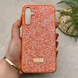 قاب گوشی Galaxy A15 سامسونگ نگین دار سواروسکی SWAROVSKI پلاک فلزی نارنجی کد 151297