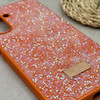 قاب گوشی Galaxy A26 سامسونگ نگین دار سواروسکی SWAROVSKI پلاک فلزی نارنجی کد 151310