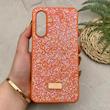 قاب گوشی Galaxy A26 سامسونگ نگین دار سواروسکی SWAROVSKI پلاک فلزی نارنجی کد 151310
