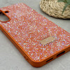 قاب گوشی Galaxy S25 FE سامسونگ نگین دار سواروسکی SWAROVSKI پلاک فلزی نارنجی کد 151348