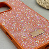 قاب گوشی iPhone 16 Pro Max آیفون نگین دار سواروسکی SWAROVSKI پلاک فلزی نارنجی کد 151397