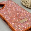 قاب گوشی iPhone 17 آیفون نگین دار سواروسکی SWAROVSKI پلاک فلزی نارنجی کد 151415