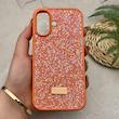 قاب گوشی iPhone 16 آیفون نگین دار سواروسکی SWAROVSKI پلاک فلزی نارنجی کد 151424