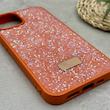 قاب گوشی iPhone 13 - 14 آیفون نگین دار سواروسکی SWAROVSKI پلاک فلزی نارنجی کد 151440