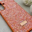 قاب گوشی Galaxy A17 سامسونگ نگین دار سواروسکی SWAROVSKI پلاک فلزی نارنجی کد 150810