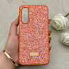 قاب گوشی Galaxy A17 سامسونگ نگین دار سواروسکی SWAROVSKI پلاک فلزی نارنجی کد 150810