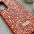 قاب گوشی Galaxy A54 سامسونگ نگین دار سواروسکی SWAROVSKI پلاک فلزی نارنجی کد 152987