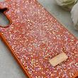 قاب گوشی Galaxy A55 سامسونگ نگین دار سواروسکی SWAROVSKI پلاک فلزی نارنجی کد 152991