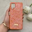 قاب گوشی Galaxy A12 - M12 سامسونگ نگین دار سواروسکی SWAROVSKI پلاک فلزی نارنجی کد 153007