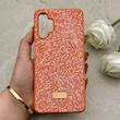 قاب گوشی Galaxy A13 4G سامسونگ نگین دار سواروسکی SWAROVSKI پلاک فلزی نارنجی کد 153010