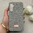 قاب گوشی Galaxy S23 FE سامسونگ نگین دار سواروسکی SWAROVSKI پلاک فلزی خاکستری کد 153033