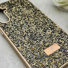 قاب گوشی Galaxy S23 FE سامسونگ نگین دار سواروسکی SWAROVSKI پلاک فلزی طلایی کد 153034