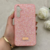قاب گوشی Galaxy S23 FE سامسونگ نگین دار سواروسکی SWAROVSKI پلاک فلزی صورتی کد 153035